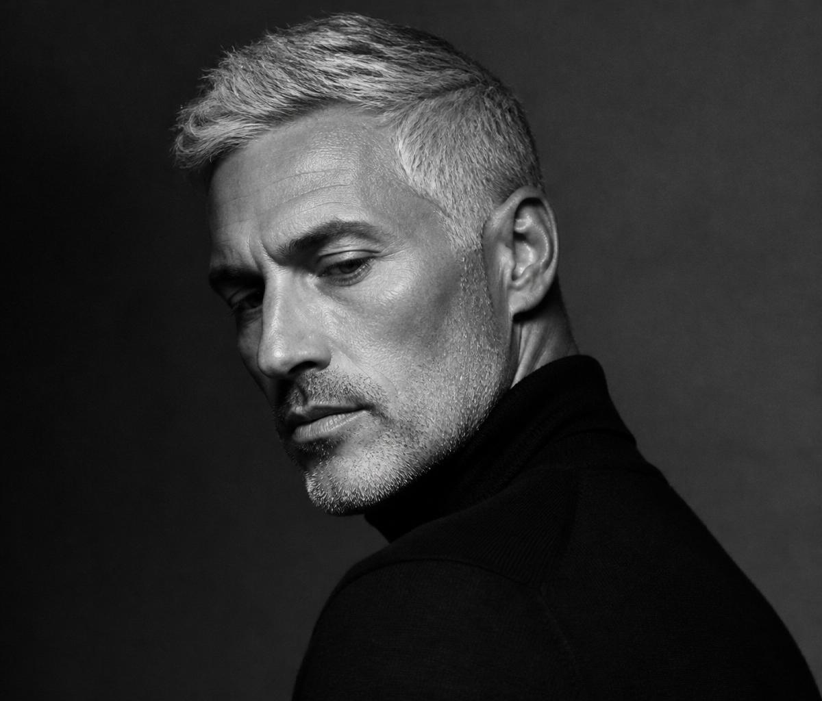 Adrian Vale — monochrome profile portrait, low-key rembrandt light